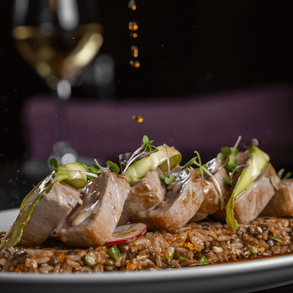 The Fusion of French Elegance and Japanese Precision 1 Seared tuna glazed with tamari and draped in a delicate blend of ponzu and roasted sesame sauces, served over vegetable fried rice